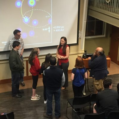 An image of Dr. Battersby fielding questions from young "proto-scientists" after a public talk.